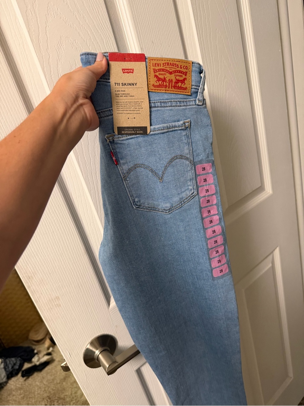 Levi's 711 Skinny Jeans in Light Blue Wash with Pink Size Tabs